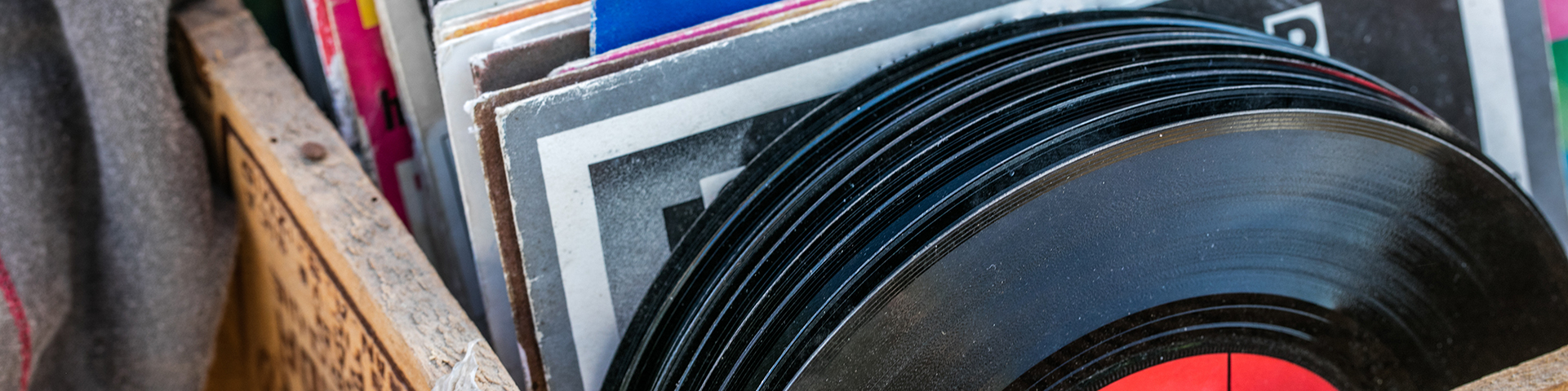 Out of focused picture of collector digging in bins